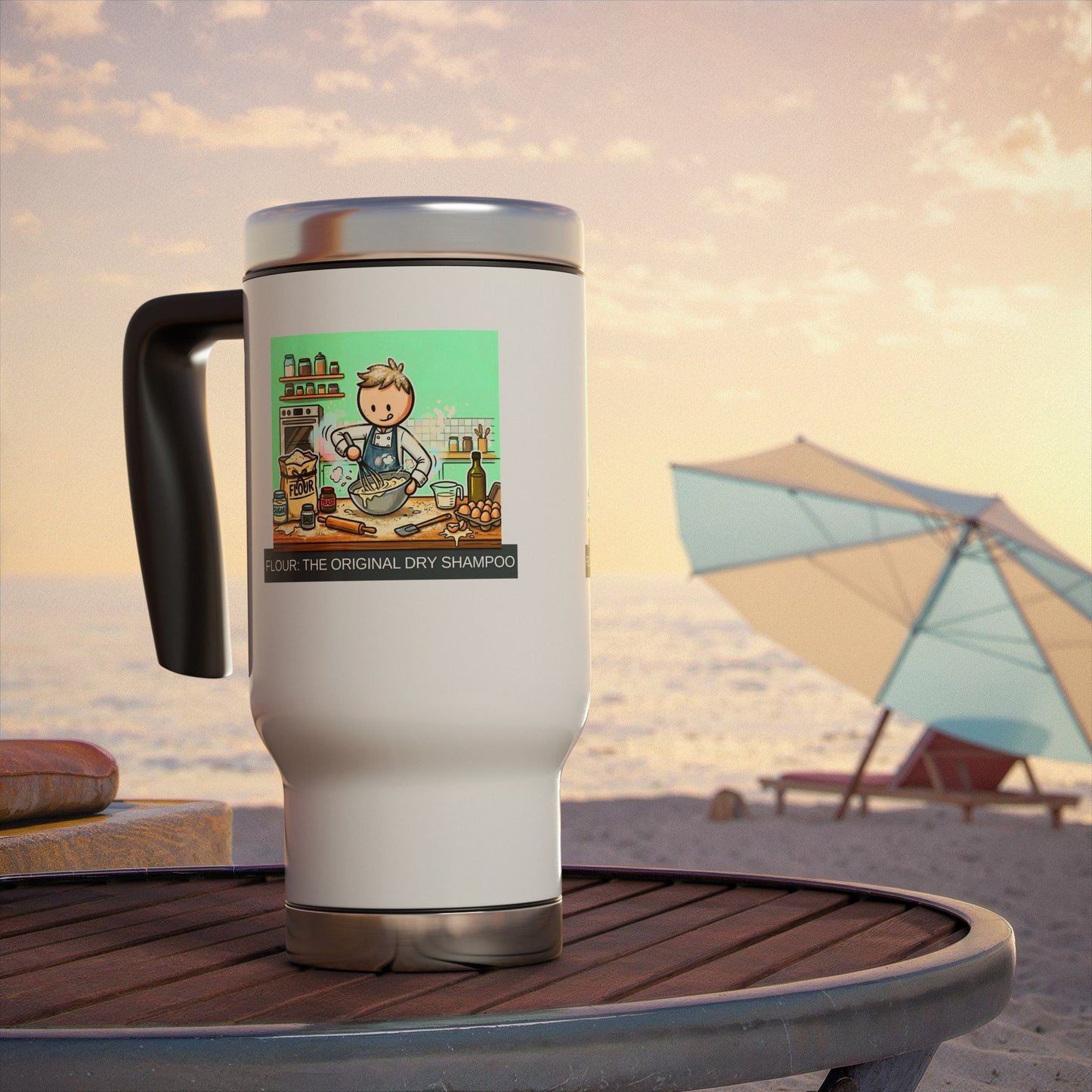 White travel mug with a graphic design on a beach table with an umbrella in the background